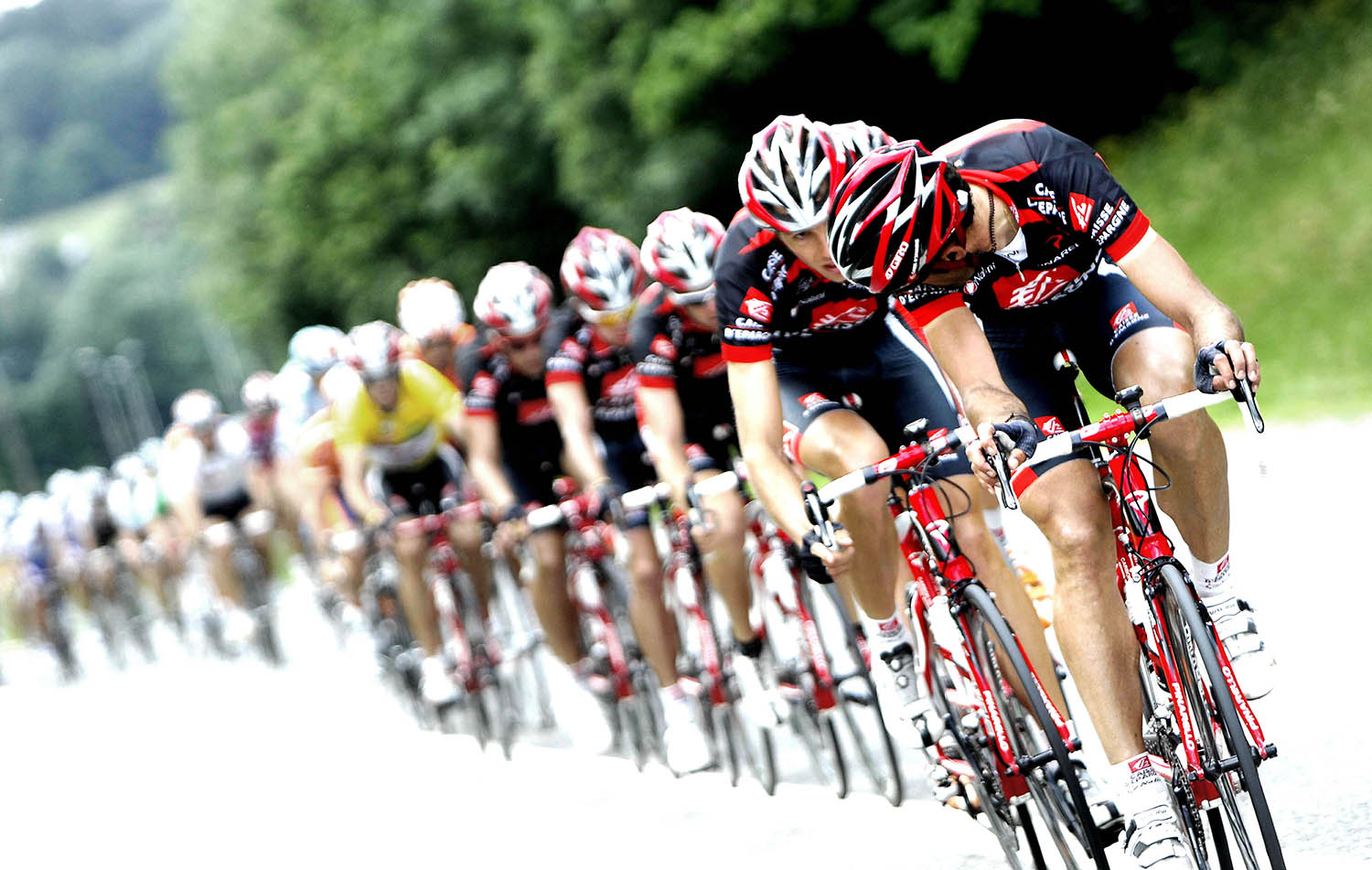 In this image provided by PhotoSport International we see ENTRE ANNEMASSE ET MORZINE LE PELOTON EST EMMENE PAR LES HOMMES DE LA CAISSE D'EPARGNE EQUIPIERS DU LEADER ALEJANDRO VALVERDE QU'ILS NE QUITTENT PAS